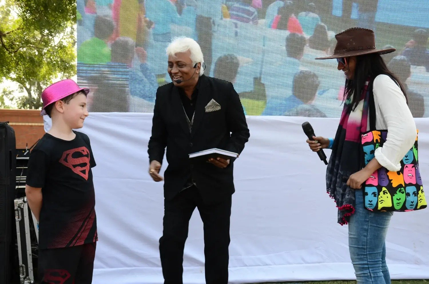 Man in suit speaking at podium with ITT logo on podium